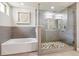 Luxurious bathroom with soaking tub and glass shower at 853 Elm St # 1, Denver, CO 80220