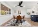 Modern dining area with stylish furniture and large windows at 999 S Otis St, Lakewood, CO 80226