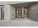 Modern building entrance with brick facade and glass doors at 603 Inca St # 305, Denver, CO 80204