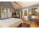 Main bedroom with a four poster bed and access to a private deck at 102 S High St, Breckenridge, CO 80424