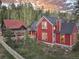 Red house exterior with adjacent building at 102 S High St, Breckenridge, CO 80424