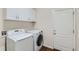 Laundry room with washer, dryer, and ample cabinet storage at 5620 Tumbleweed Ave, Firestone, CO 80504