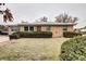 Front view of a ranch house with a well-maintained lawn at 599 Ursula St, Aurora, CO 80011