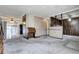 Another view of the living room, with a view into the kitchen area at 599 Ursula St, Aurora, CO 80011