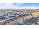 Wide aerial view showing house, neighborhood, and distant mountains at 5241 S Shawnee St, Aurora, CO 80015
