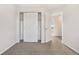 Bedroom with sliding door closet and access to another room at 5241 S Shawnee St, Aurora, CO 80015