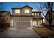 Two-story house with attached garage, illuminated at night at 5241 S Shawnee St, Aurora, CO 80015