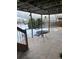 Covered patio with table, chairs, and hammock at 5241 S Shawnee St, Aurora, CO 80015