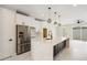 Modern kitchen with a large island and stainless steel appliances at 2901 W 4Th Ave, Denver, CO 80219