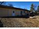 Rear view of house with garage, door, and patio area at 15669 E Hamilton Pl, Aurora, CO 80013