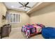 Baseball-themed bedroom with a comfortable sitting area at 8571 Windhaven Dr, Parker, CO 80134