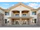 Exterior view of a two-story apartment building with balconies at 18633 Stroh Rd # 1-106, Parker, CO 80134