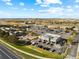 Aerial view of a shopping center and parking lot at 18633 Stroh Rd # 1-106, Parker, CO 80134