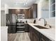 Modern kitchen with stainless steel appliances and ample counter space at 18633 Stroh Rd # 1-106, Parker, CO 80134