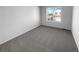 Well-lit bedroom with carpet and a window at 12334 Nate Cir, Parker, CO 80134