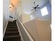 Indoor staircase leading to the upper level at 22975 E Ontario Dr # 106, Aurora, CO 80016