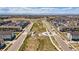 Aerial view of a residential neighborhood with a central park at 16231 E Warner Pl, Denver, CO 80239