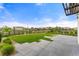 Landscaped backyard with spacious patio and grassy lawn at 16231 E Warner Pl, Denver, CO 80239