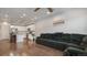 Open floor plan living room and kitchen with hardwood floors and island at 16231 E Warner Pl, Denver, CO 80239