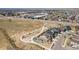 Aerial view of homes and community amenities, including parks and open space at 16231 E Warner Pl, Denver, CO 80239