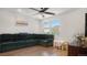 Bright living room featuring hardwood floors, a sectional sofa, and large windows at 16231 E Warner Pl, Denver, CO 80239