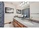 Bathroom with granite countertops, double sinks, and a shower/tub combo at 20816 E Shefield Pl, Parker, CO 80138