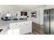 Modern kitchen island with white shaker cabinets and quartz countertops at 9840 W 36Th Ave, Wheat Ridge, CO 80033