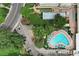 Aerial view of community pool, green spaces, and parking at 650 S Alton Way # 5D, Denver, CO 80247