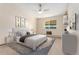 Virtually staged main bedroom with a comfortable bed and window access at 650 S Alton Way # 5D, Denver, CO 80247