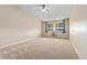 Spacious carpeted bedroom with ceiling fan and window at 650 S Alton Way # 5D, Denver, CO 80247