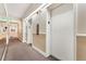 Clean hallway with elevators and carpeted floors at 650 S Alton Way # 5D, Denver, CO 80247