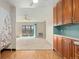 Kitchen with wood cabinets, light countertops, and appliances at 650 S Alton Way # 5D, Denver, CO 80247