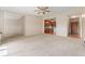 Living room with open floor plan, kitchen, and entryway access at 650 S Alton Way # 5D, Denver, CO 80247