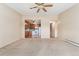Living area with open concept kitchen and access to hallway at 650 S Alton Way # 5D, Denver, CO 80247