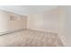 Spacious living room featuring carpeted floors and neutral walls at 650 S Alton Way # 5D, Denver, CO 80247