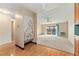 Open living room with carpeted floor and access to a balcony at 650 S Alton Way # 5D, Denver, CO 80247