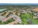 Aerial view showcasing the property's location near a golf course and lake at 650 S Alton Way # 5D, Denver, CO 80247