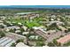 Community overview featuring a golf course, pool, and residential buildings at 650 S Alton Way # 5D, Denver, CO 80247