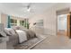 Virtually staged bedroom with a queen bed and access to a hallway at 650 S Alton Way # 5D, Denver, CO 80247