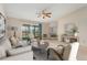 Virtually staged living room with a view to balcony at 650 S Alton Way # 5D, Denver, CO 80247
