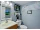 Powder room with golf-themed decor and a pedestal sink at 14696 E Hawaii Pl, Aurora, CO 80012