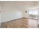 Bright living room with wood-look floors and balcony access at 1150 Golden Cir # 511, Golden, CO 80401