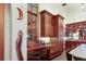 Bright kitchen boasts ample wood cabinetry, built-in desk, and a cheerful window seat at 3015 3Rd St, Boulder, CO 80304