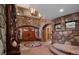 Grand entryway with stone walls and intricate tile flooring at 3015 3Rd St, Boulder, CO 80304