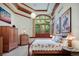 Bright bedroom with large window, wooden furniture, and a comfortable bed at 3015 3Rd St, Boulder, CO 80304