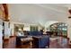 Spacious living room with hardwood floors, large windows, and a grand piano at 3015 3Rd St, Boulder, CO 80304