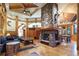 Expansive living area features a grand stone fireplace and hardwood floors at 3015 3Rd St, Boulder, CO 80304