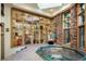 Indoor hot tub surrounded by glass walls and stone accents at 3015 3Rd St, Boulder, CO 80304