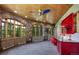 Sunroom with stone walls, large windows, and a workspace at 3015 3Rd St, Boulder, CO 80304