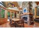 Rustic dining area with wood table and chairs, adjacent to a stone fireplace at 3015 3Rd St, Boulder, CO 80304